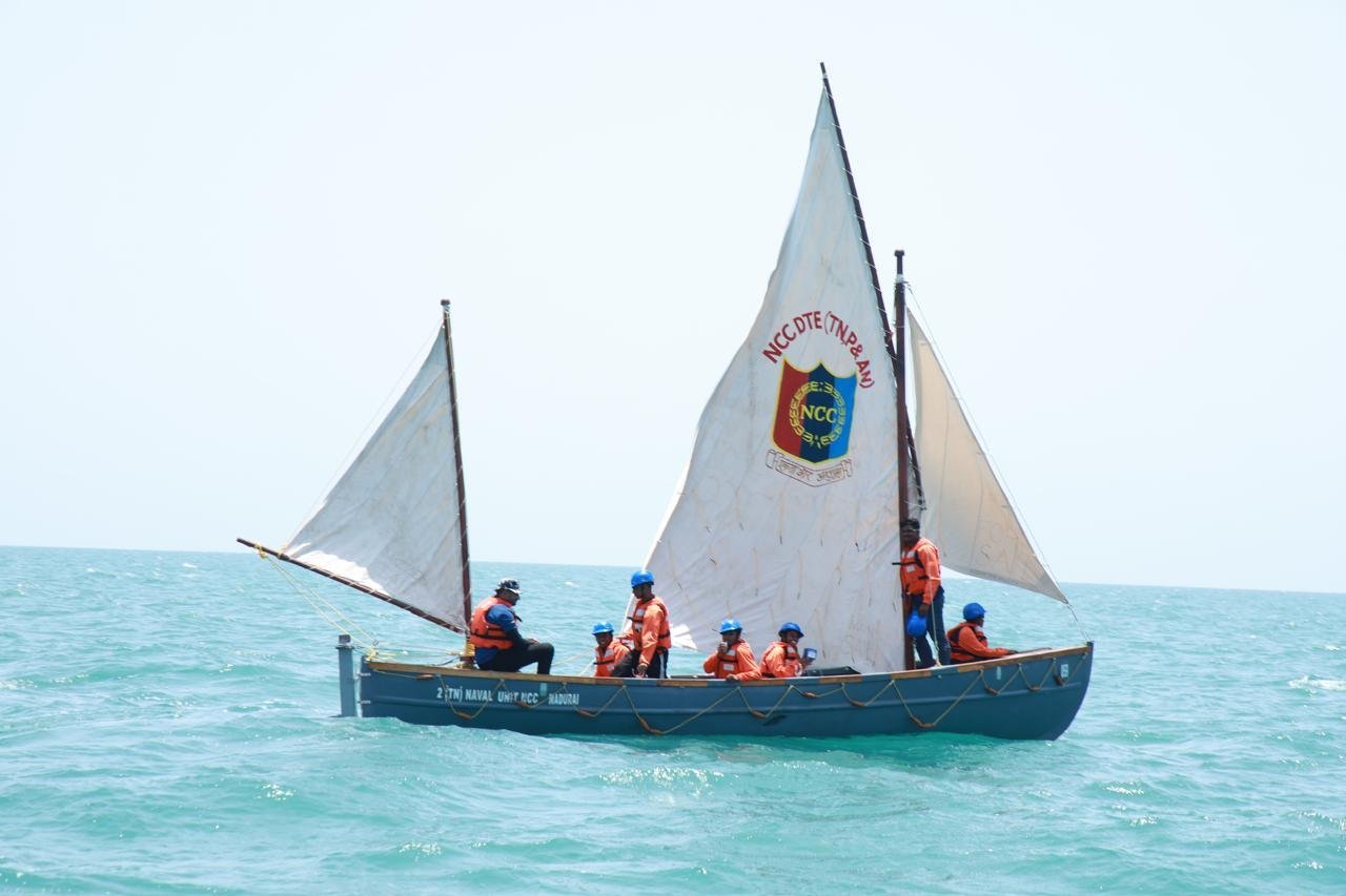 An NCC whaler under sail in the Bay of Bengal, crewed by cadets in life jackets