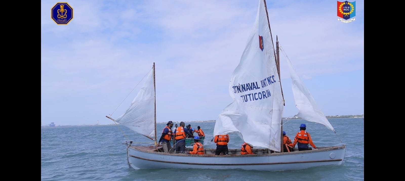 Sailboat under way with 3(TN) Naval Unit NCC Tuticorin painted on its sail